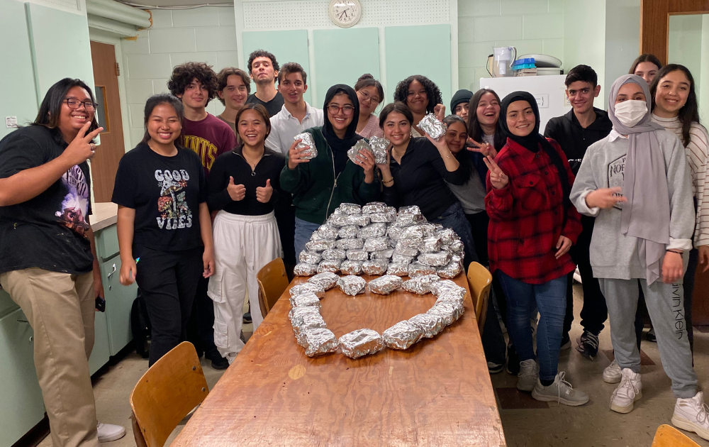 In 2023, the NCC Youth Volunteer Club packed sandwiches to support One City Peterborough's outreach to people experiencing homelessness