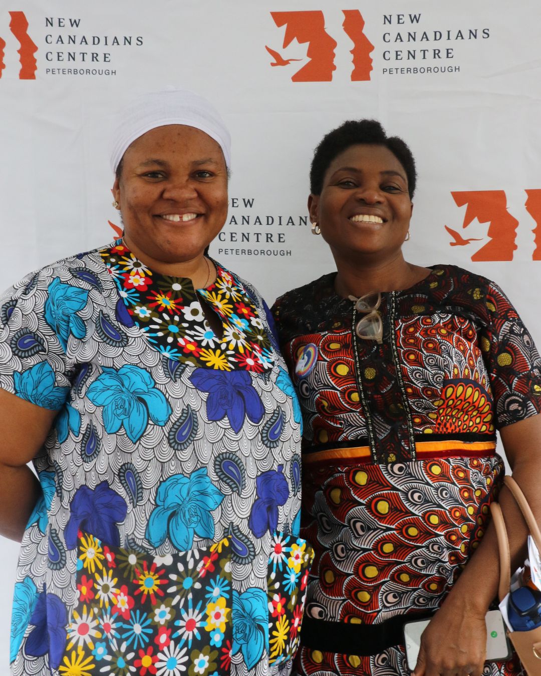 two women standing side by side